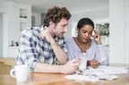 Couple looking over receipts and other paperwork